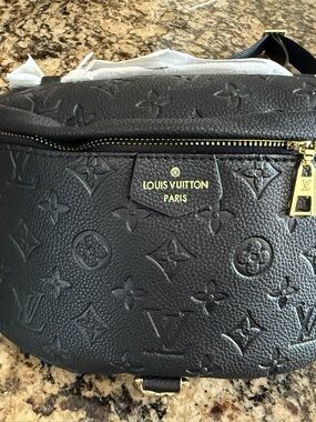 NWOT. Louis Vuitton Black Monogram Embossed Leather Crossbody bum Bag